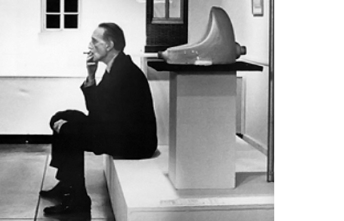 2/9-- Duchamp in the 1950s, with one of the many facsimiles of the original urinal.
